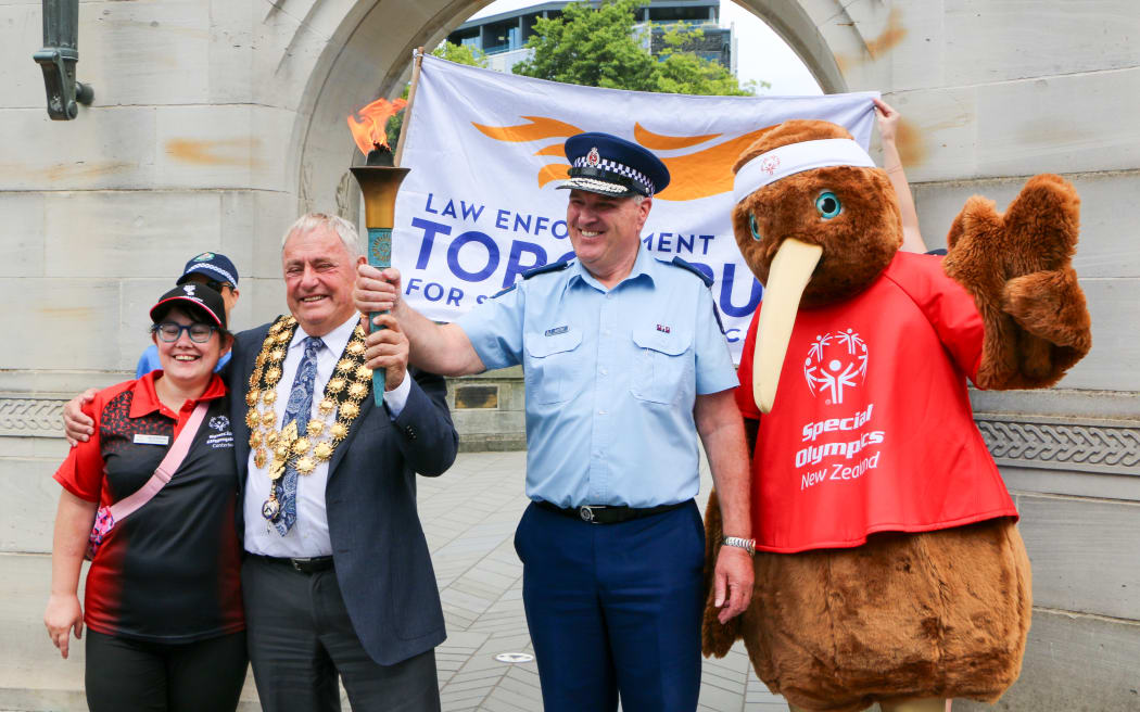 (From left) Special Olympics athlete Jessica Stevens, Christchurch mayor Phil Mauger, Canterbury metro area commander Superintendent Lane Todd and the Special Olympics Kiwi mascot following Tuesday's torch run.
