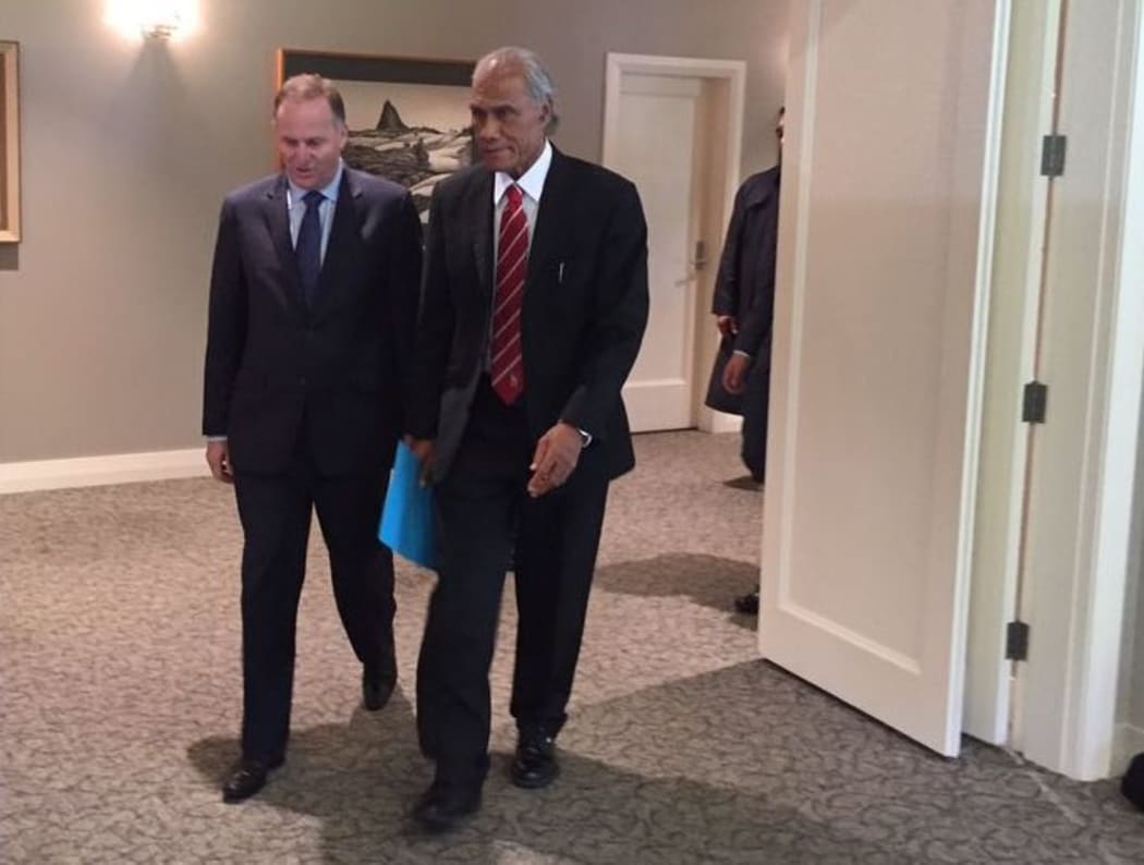 John Key walks with 'Akilisi Pohiva at Government House in Auckland