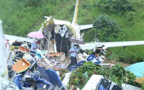 A view of the Air India Express plane crashed in Kerala, India, on August 8, 2020. An Air India Express plane with 190 people on board has crashed at an airport in the southern state of Kerala,