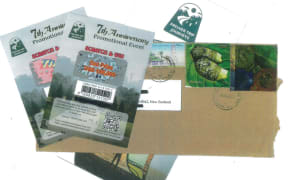 An image of the envelopes being sent out in the post.