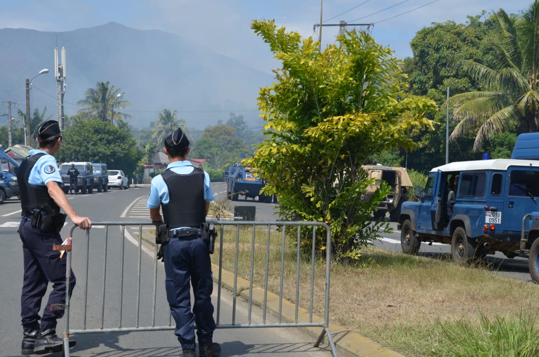 Police on the blocked road south of Noumea near St Louis in New Caledonia