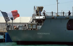 Visitors (R) tour the French frigate Vendemaire during her port call Hong Kong on March 18, 2012.  The Vendemiaire is a light monitoring frigate of the French Marine Nationale and is the fifth ship of the Floreal class, and is named after Vendemiaire, the first month of the Republican Calendar.    AFP PHOTO / LAURENT FIEVET (Photo by LAURENT FIEVET / AFP)