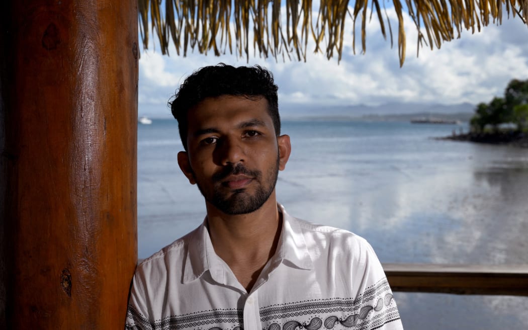 In a photo taken on July 12, 2022, Vishal Prasad a local university student and climate campaigner, speaks to AFP at the Pacific Islands Forum (PIF) in Suva. (Photo by William WEST / AFP)