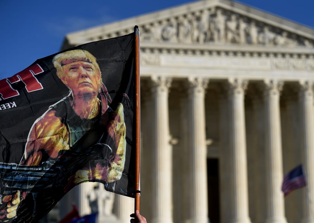 Supporters of US President Donald Trump participate in the Million MAGA March  to protest the outcome of the 2020 presidential election in front of the US Supreme Court on December 12, 2020 in Washington, DC.
