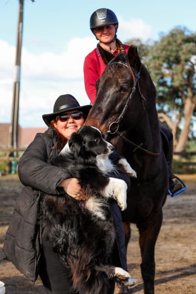 Anna Baigent with her border collie and a young person on the horse called Rocanto.