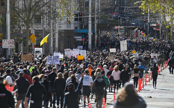 Thousands of anti-lockdown protestors march on the streets of the central business district of Sydney on July 24, 2021,