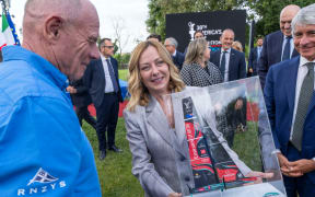 Team New Zealand chief executive Grant Dalton presents  Italian Prime Minister Giorgia Meloni with a scale model of its 2024 boat, Taihoro, at a function in Rome, 27 May, 2025.