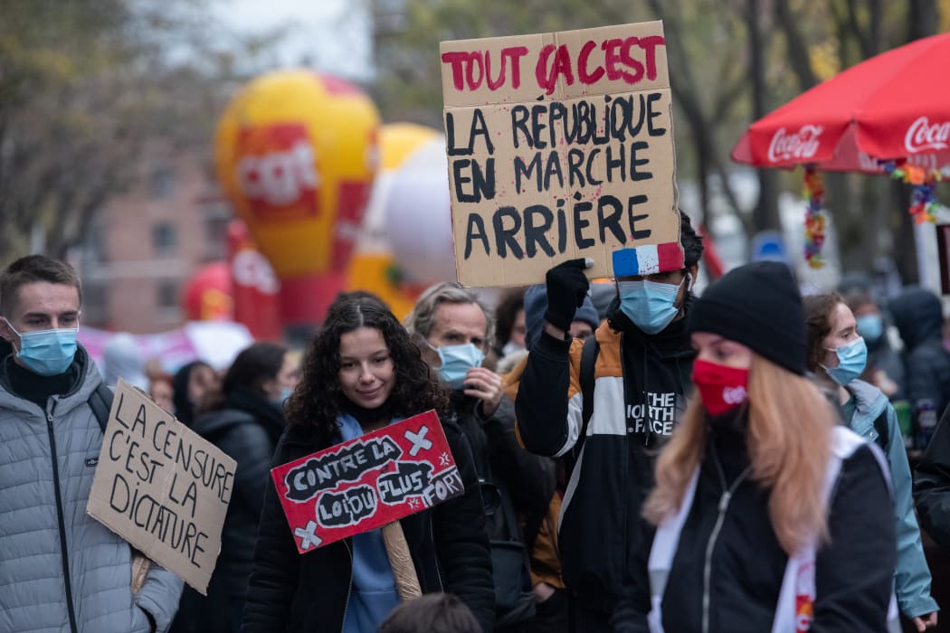 Crowds demonstrating on the streets of Paris a week after the massive mobilization against the draft Global Security Law.