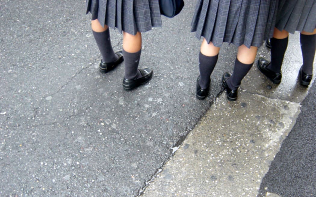 School girls in uniform, with socks.