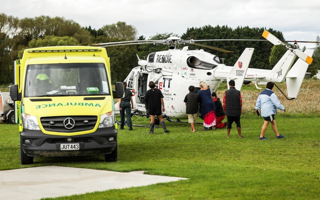 Evacuees are assisted in a part of the East Coast in the wake of Cyclone Gabrielle