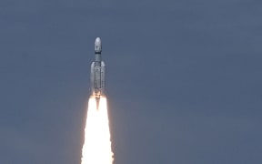 An Indian Space Research Organisation (ISRO) rocket carrying the Chandrayaan-3 spacecraft lifts off from the Satish Dhawan Space Centre in Sriharikota, an island off the coast of southern Andhra Pradesh state on July 14, 2023. India launched a rocket on July 14 carrying an unmanned spacecraft to land on the Moon, its second attempt to do so as its cut-price space programme seeks to reach new heights. (Photo by R. Satish BABU / AFP)