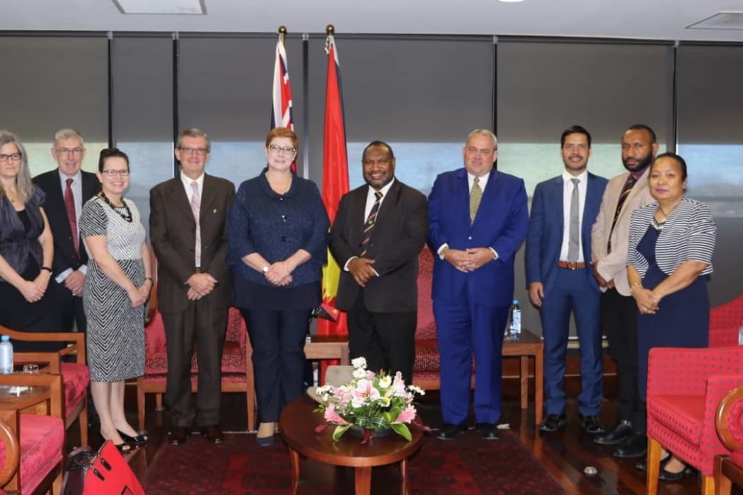 Australia's Defence Minister Marise Payne (fifth from left) meets PNG Prime Minister James Marape (next to Ms Payne) and members of his government.