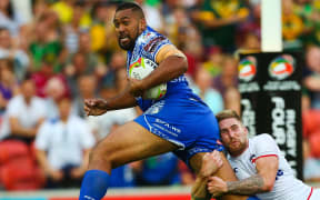 Samoa's Frank Pritchard is tackled by Sam Tomkins