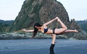 Franko Heke and Nikki Rhodes doing yoga