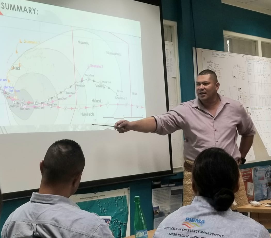Tonga's National Emergency Management Committee meet to discuss Tropical Cyclone Sarai.