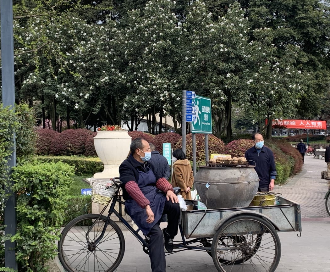 Street seller with roasted sweet potatoes