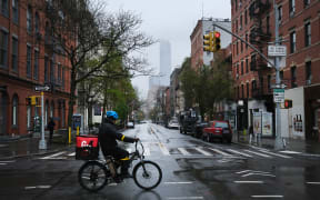 Streets stand nearly empty in the popular Manhattan shopping district of SoHo on 26 April 2020.