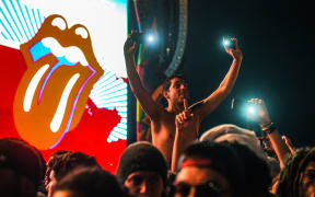 Fans take pictures at the free Rolling Stones concert which was being hailed as an historic event.