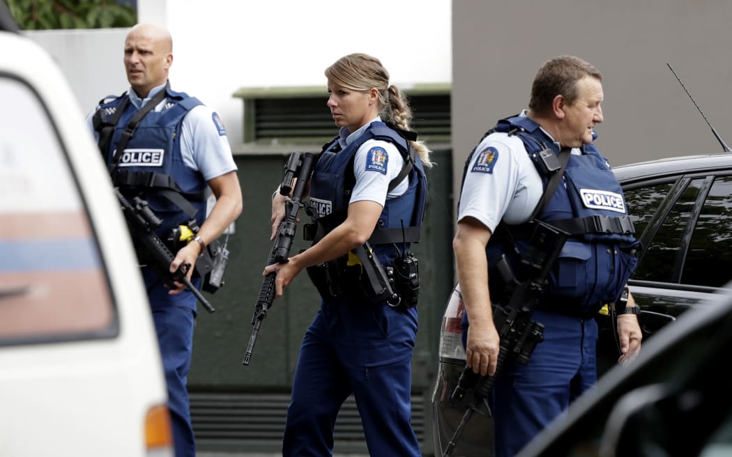 Armed police patrol outside a mosque in central Christchurch, New Zealand, Friday, March 15, 2019. A witness says many people have been killed in a mass shooting at a mosque in the New Zealand city of Christchurch. (AP Photo/Mark Baker)