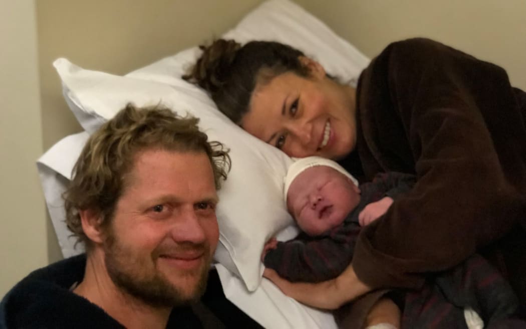 Kristi James with her partner and son.