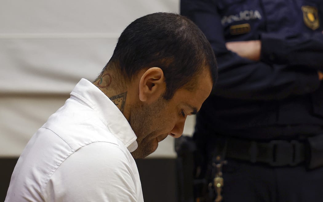 Brazilian footballer Dani Alves looks down during his trial at the High Court of Justice of Catalonia in Barcelona, 2024.