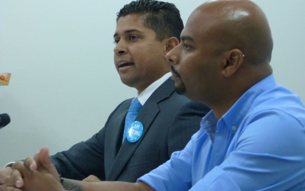 Fiji's supervisor of elections Mohammed Saneem, left, and MIDA head Ashwin Raj.