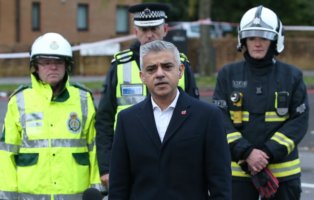 Mayor of London Sadiq Khan, centre, with members of the emergency services.