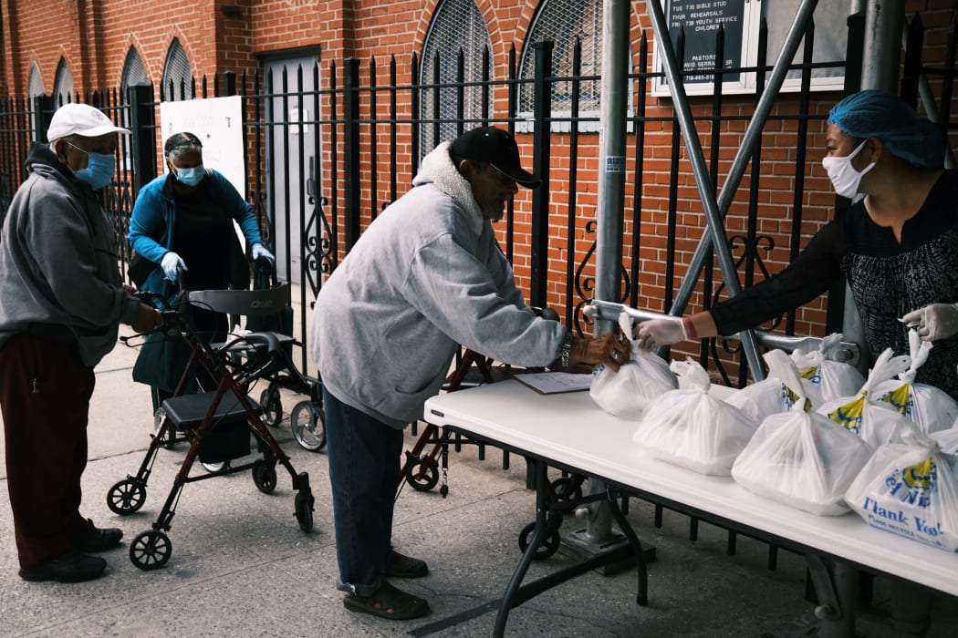 Meals are handed out at church in The Bronx, New York City. The area has long struggled with poverty, but been especially impacted by the Covid-19 pandemic.