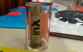 Crown lawyer Andrew McRae says this empty gun cartridge found at the WINZ office, with the same 'inX' label Russell Tully's belongings had on them, places him at the scene of the crime.
