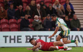 Tonga's Isaiya Katoa scores during the Rugby League World Cup Pool D match between Tonga and Cook Islands at the Riverside Stadium, Middlesbrough