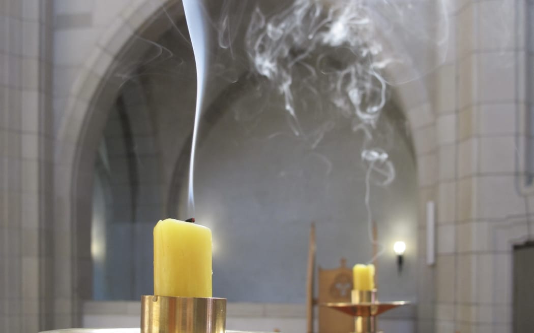 Candles smoking after being snuffed.
