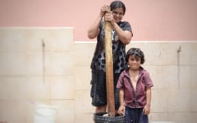 Yogeshni Lata hand-washes her family's clothes while she can