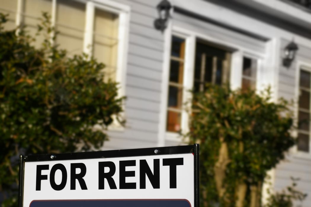 House  with "For Rent" sign in front