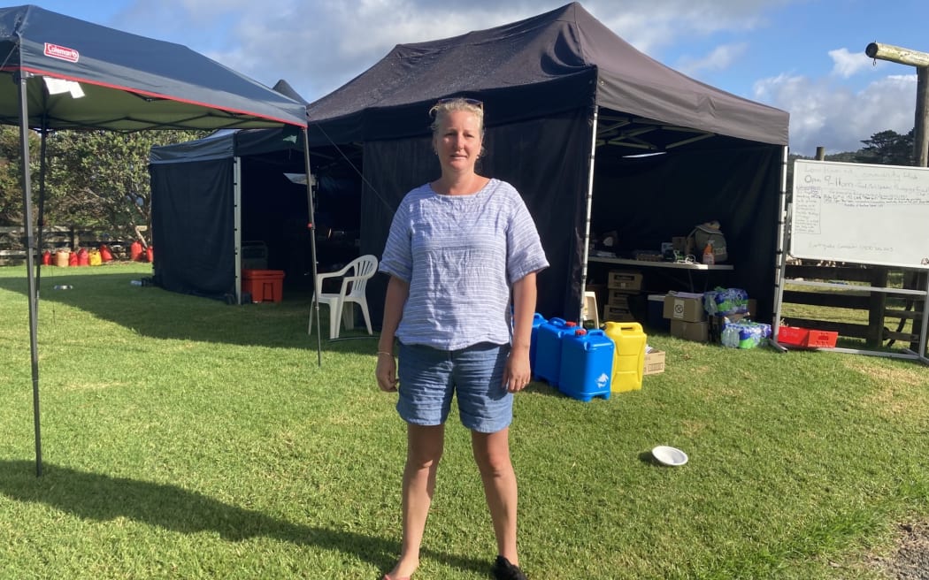 Sarah Cannon's property is being used as a make-shift community hub for Karekare locals to grab food and fuel aid after Cyclone Gabrielle left the community isolated.