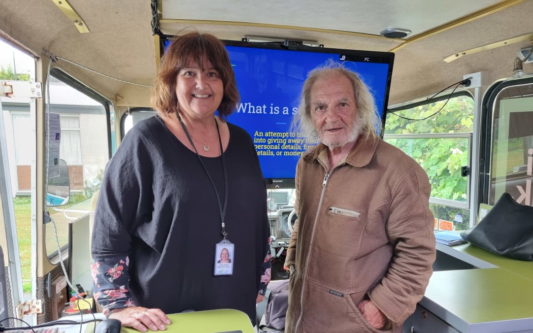 Otautahi Community Housing Trust Digital Coach Advisor Joanne Cantrick goes over some tips on using a laptop with Laurie Hardman.