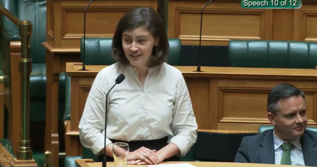 Green MP Chlöe Swarbrick speaking in parliament and responding to heckling with 'okay, Boomer'.