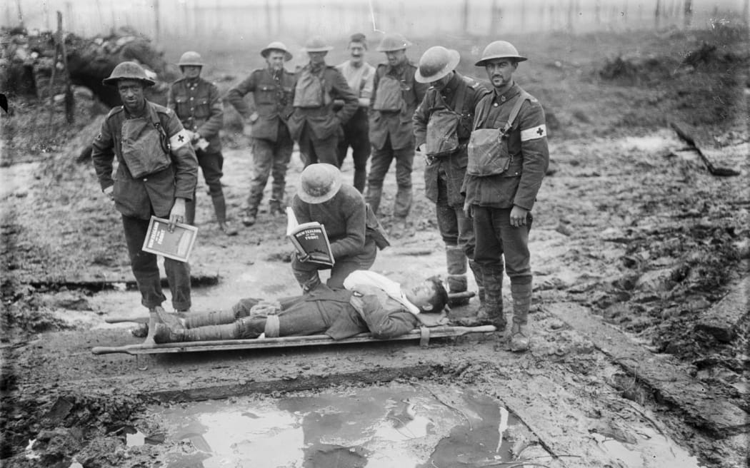 A wounded NZ soldier on a stretcher in Belgium, late 1917.