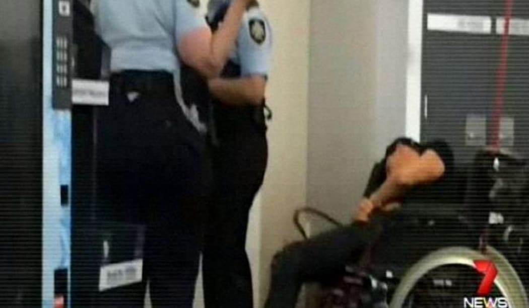 Police attempt to question Grant Hackett at Melbourne airport.