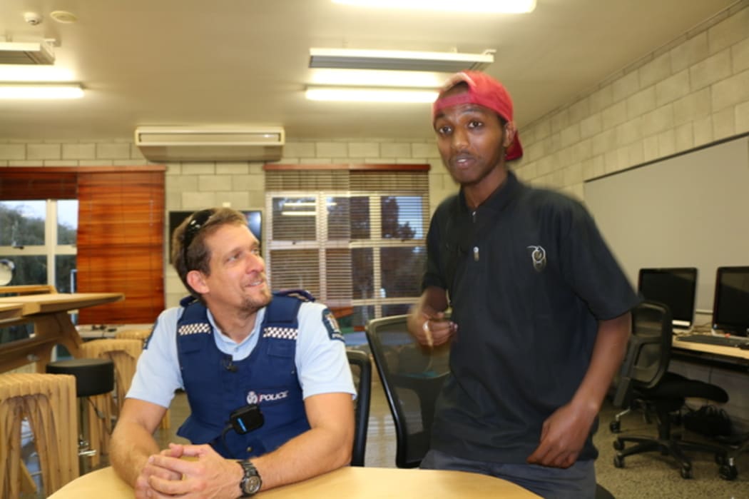 Ethnic Liaison Officer Constable Rob Stanton with Mahad Yusef.