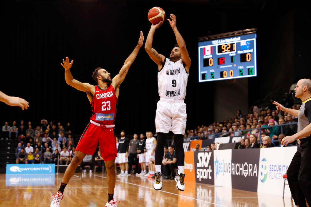 Corey Webster shoots for three points.
