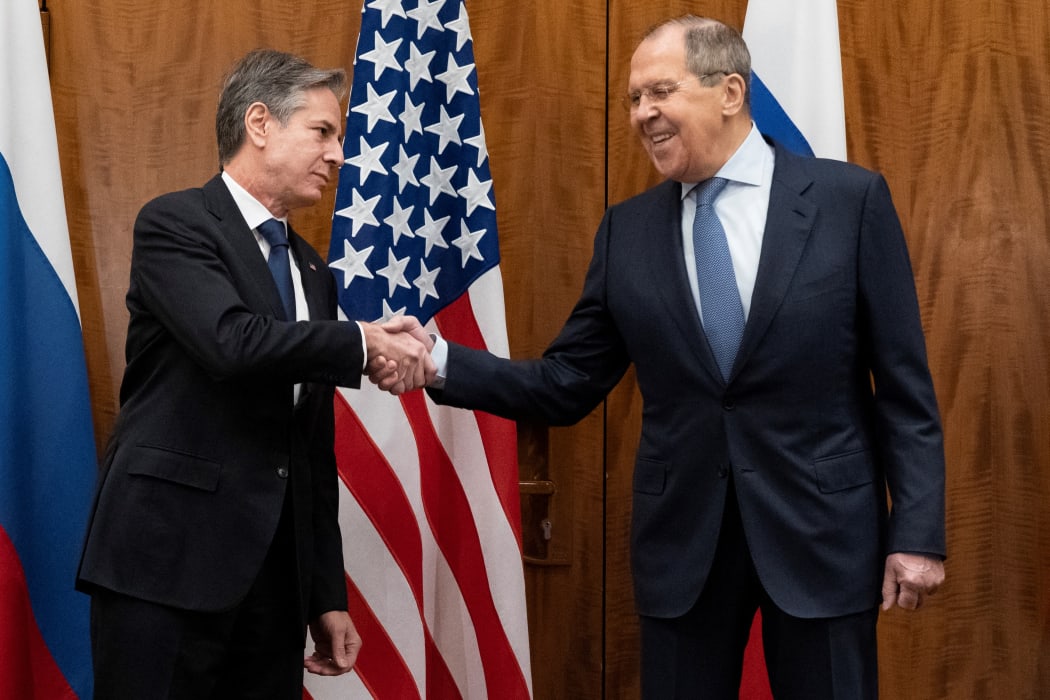 US Secretary of State Antony Blinken (left) and Russian Foreign Minister Sergey Lavrov shake hands before their meeting on 21 January, 2022, in Geneva, Switzerland.