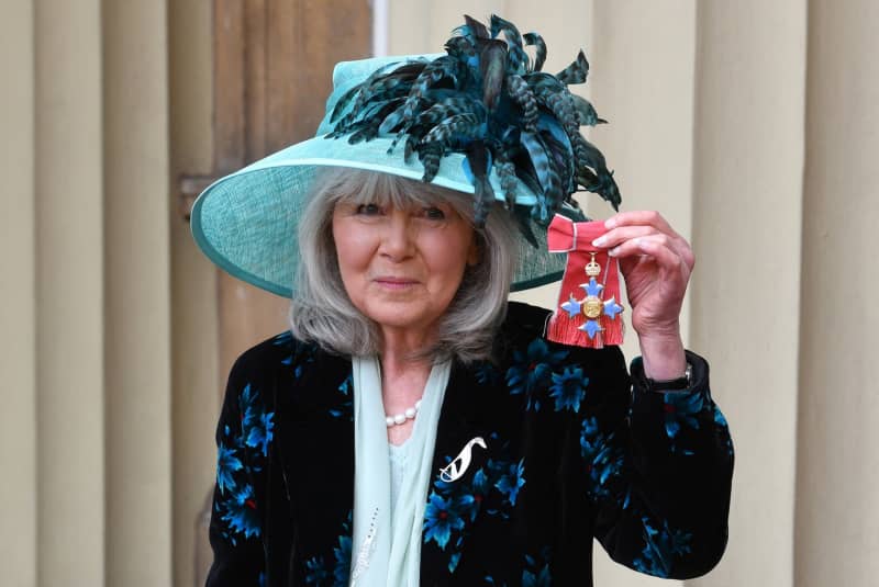 Author Jilly Cooper poses with her medal after she was appointed a Commander of the Order of the British Empire (CBE) at an investiture ceremony at Buckingham Palace in London on 20 March 2018.