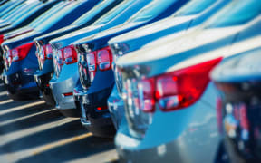 Parked cars for sale, car yard.