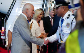 Britain's King Charles III and Queen Camilla arrive at Apia Airport for the Commonwealth Heads of Government Meeting (CHOGM) in Apia on 23 October 2024.