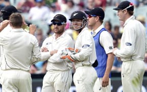 New Zealand captain Brendon McCullum, second left, and wicketkeeper BJ Watling wait for the decision over Australian batsman Nathan Lyon's sweep-shot.