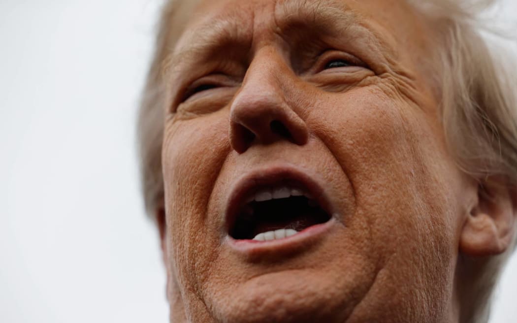 LONDONDERRY, NEW HAMPSHIRE - JANUARY 23: Republican presidential candidate, former U.S. President Donald Trump tells people to go back inside and vote as he visits the polling site at Londonderry High School on primary day, on January 23, 2024 in Londonderry, New Hampshire. With Florida Gov. Ron DeSantis having dropped out of the race two days earlier, Trump and fellow candidate former UN Ambassador Nikki Haley are battling it out in this first-in-the-nation primary.   Chip Somodevilla/Getty Images/AFP (Photo by CHIP SOMODEVILLA / GETTY IMAGES NORTH AMERICA / Getty Images via AFP)