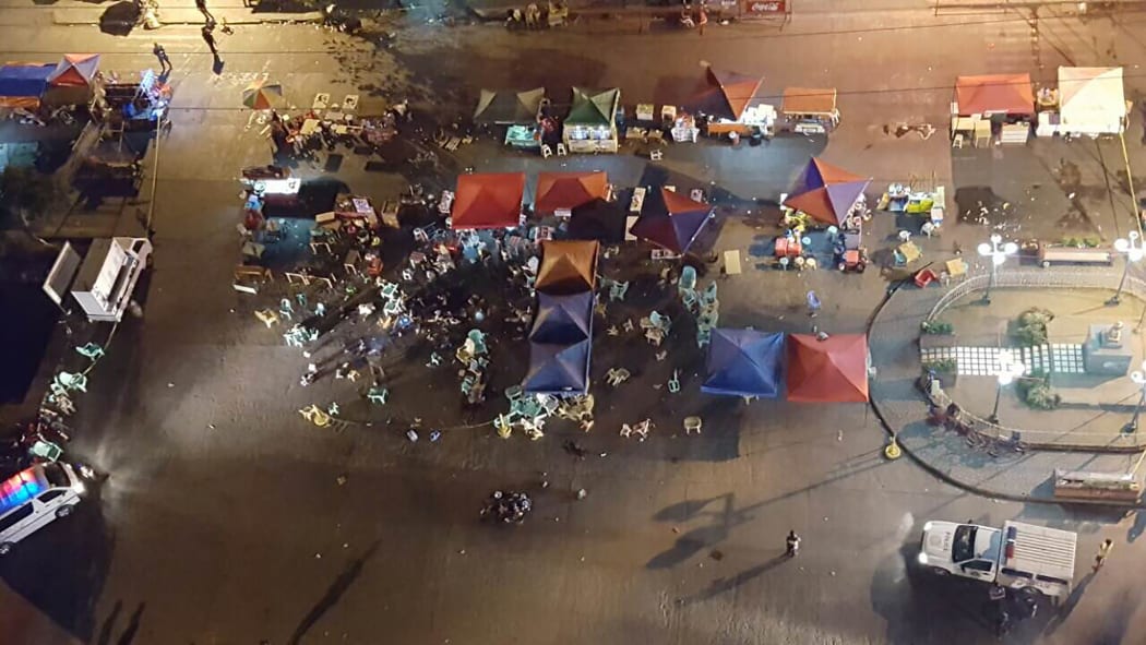 A photo taken from a mobile phone shows a general view of the site of an explosion at a night market in Davao City, in southern island of Mindanao, Philippines