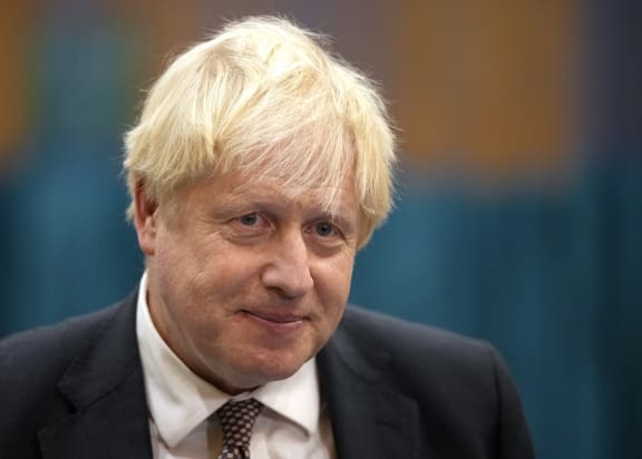 Britain's Prime Minister Boris Johnson speaks to the media as he visits a Covid-19 vaccination centre at Little Venice Sports Centre in London on October 22, 2021.