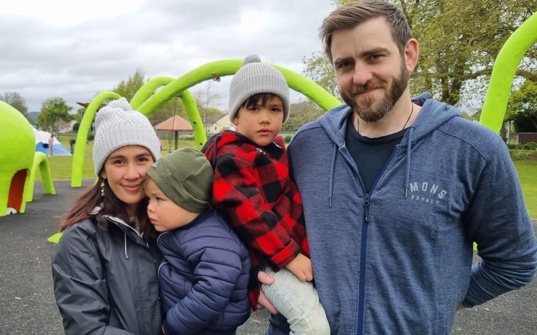 Judy and Brad Hollard with Bennett, two, and Harrison, four.