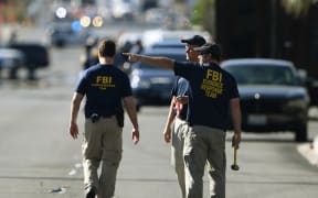 FBI investigators work outside the Route 91 festival venue.